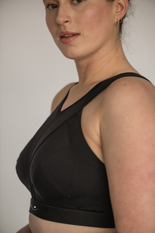 Photo of a model wearing the high impact sports bra by Elansu which was designed for fuller busts